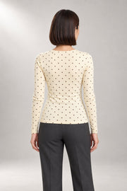 Adira Long-Sleeve Top — Fitted Polka-Dot Knit — back view in our studio