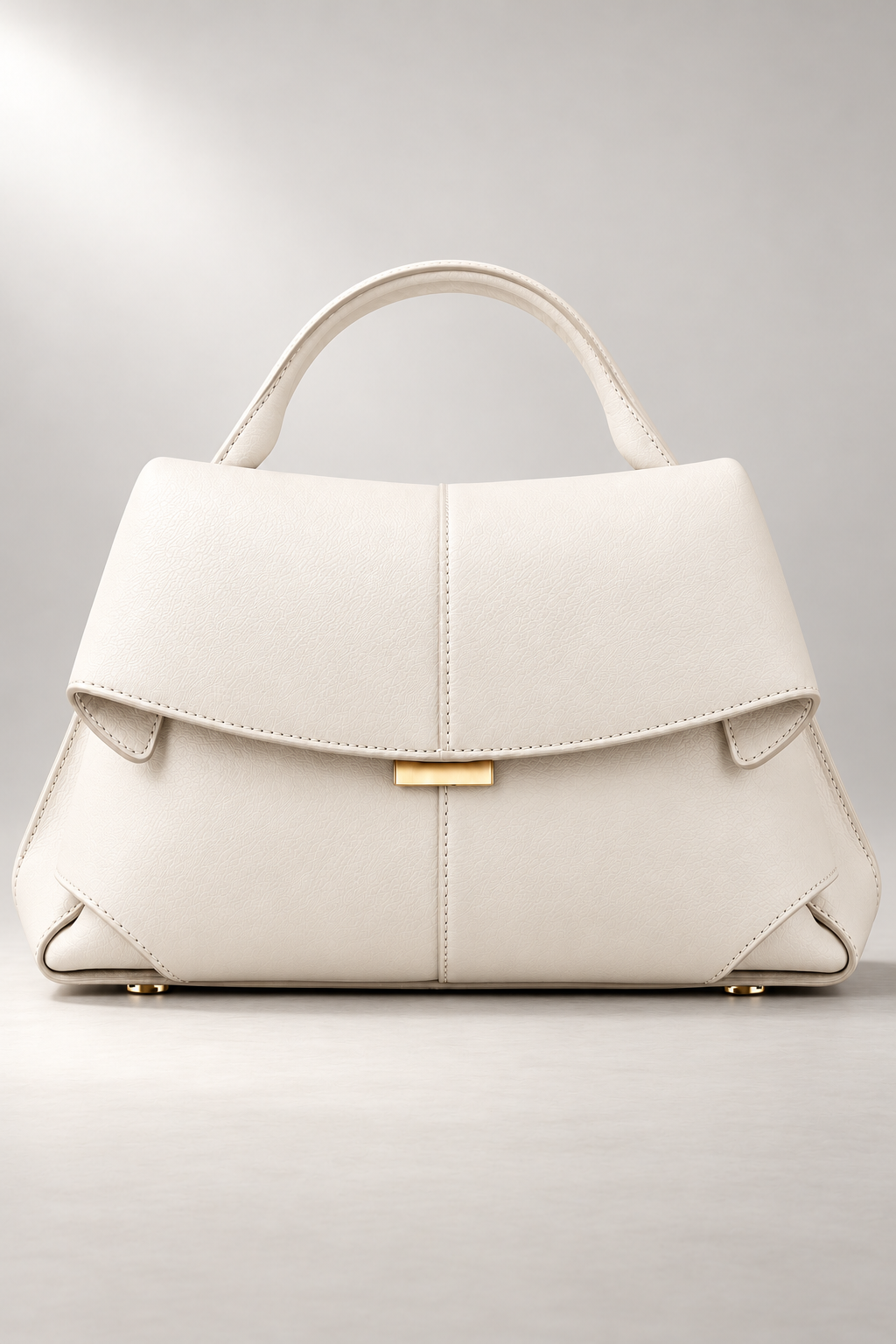 Matera Sculpted Handbag — Foldover Flap & Top Handle — White studio view