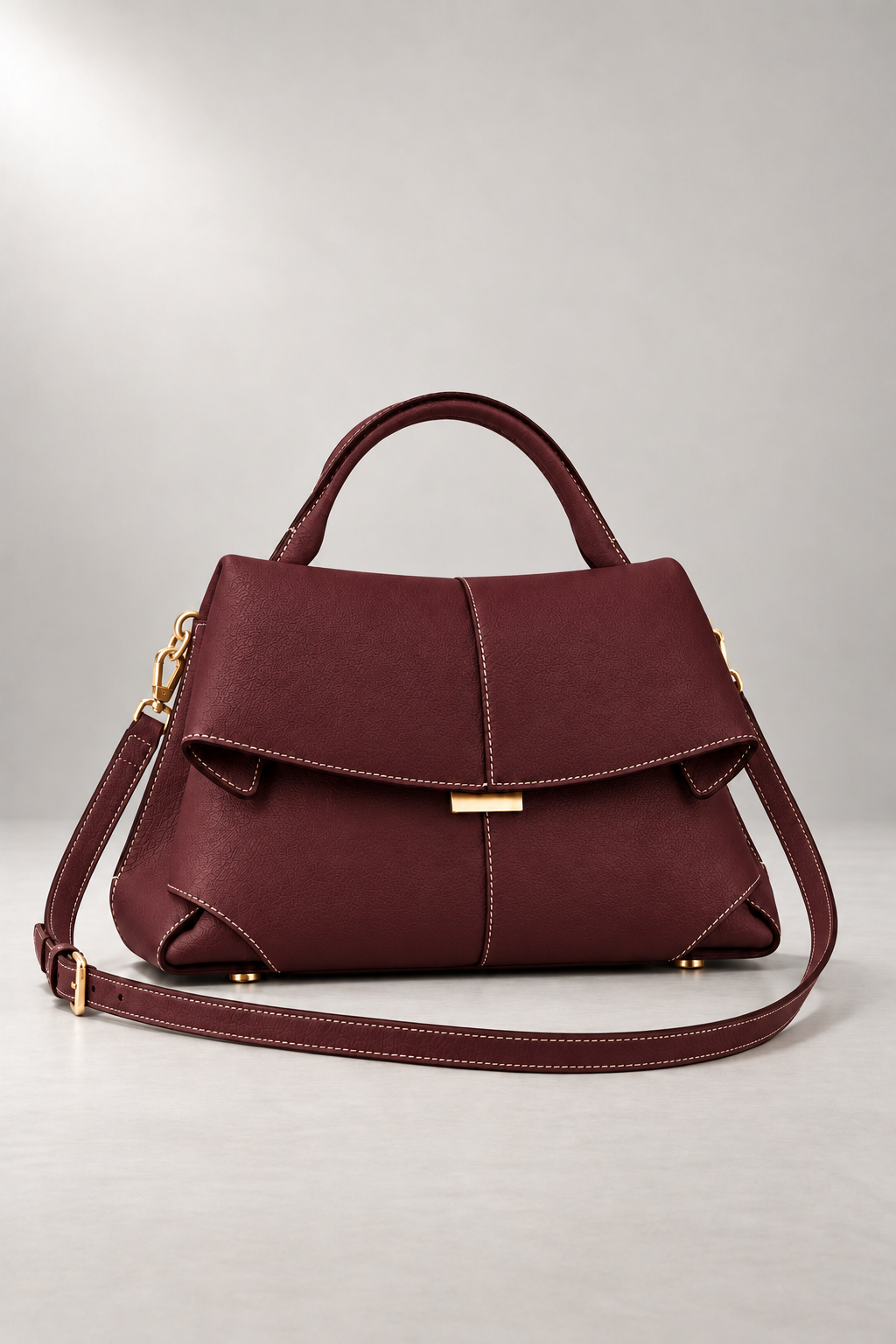 Matera Sculpted Handbag — Foldover Flap & Top Handle — Burgundy studio view